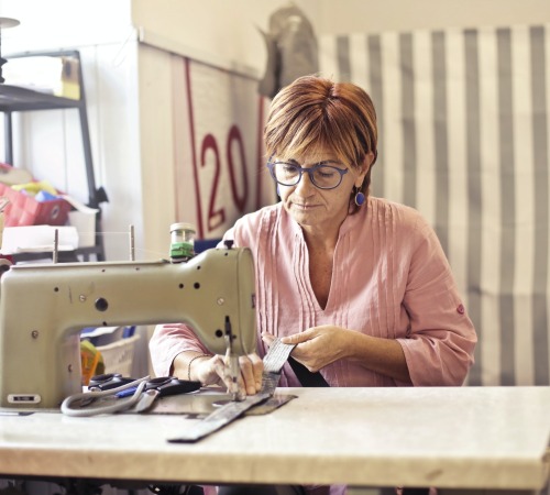 Seamstress working on a sash